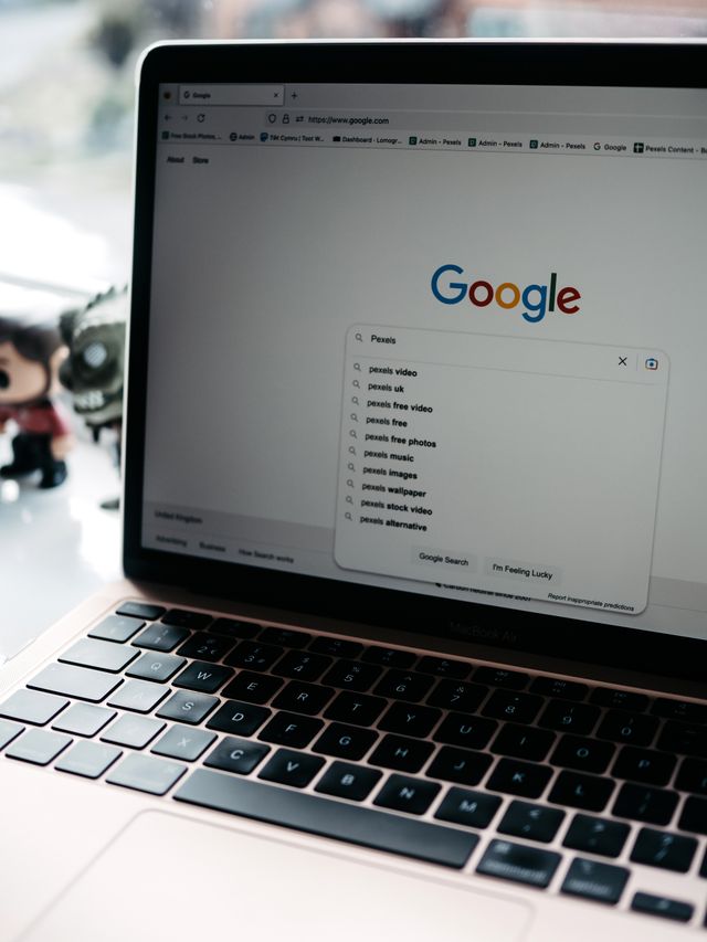 Laptop displaying Google search suggestions